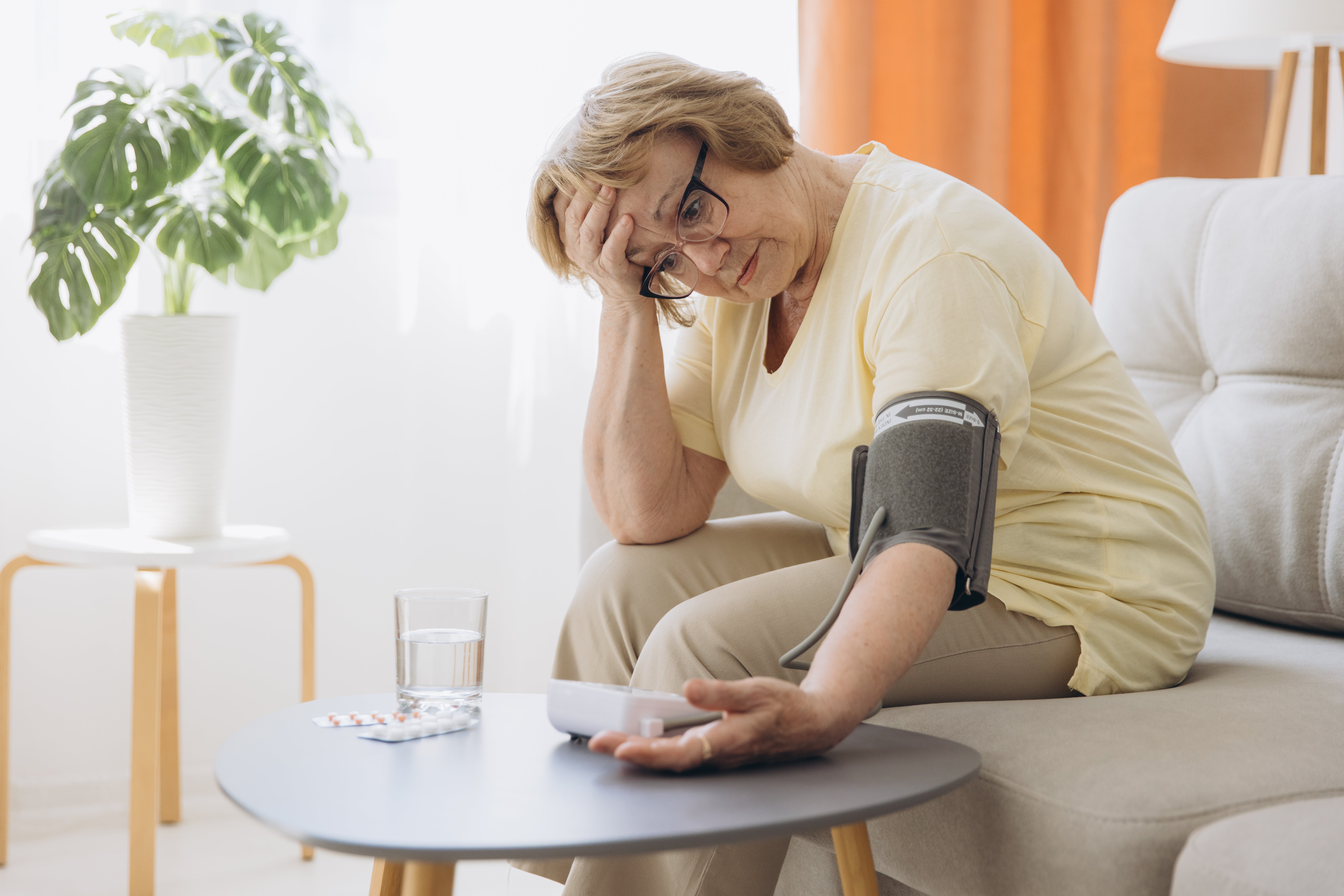 senior-woman-with-hypertension-measuring-blood-pressure-herself-home-sad-elderly-lady-measure-blood-pressure-using-tonometer-everyday-health-checkup